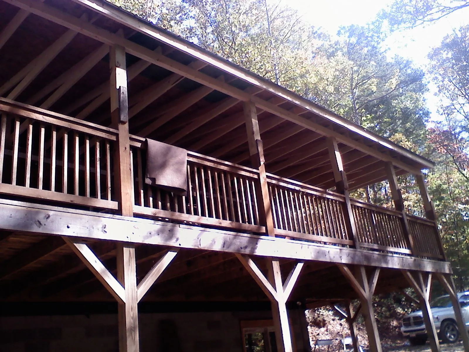 Timber framing under a new elevated porch and deck — Roof Leak Repair in Cochrane by Roofing Brothers